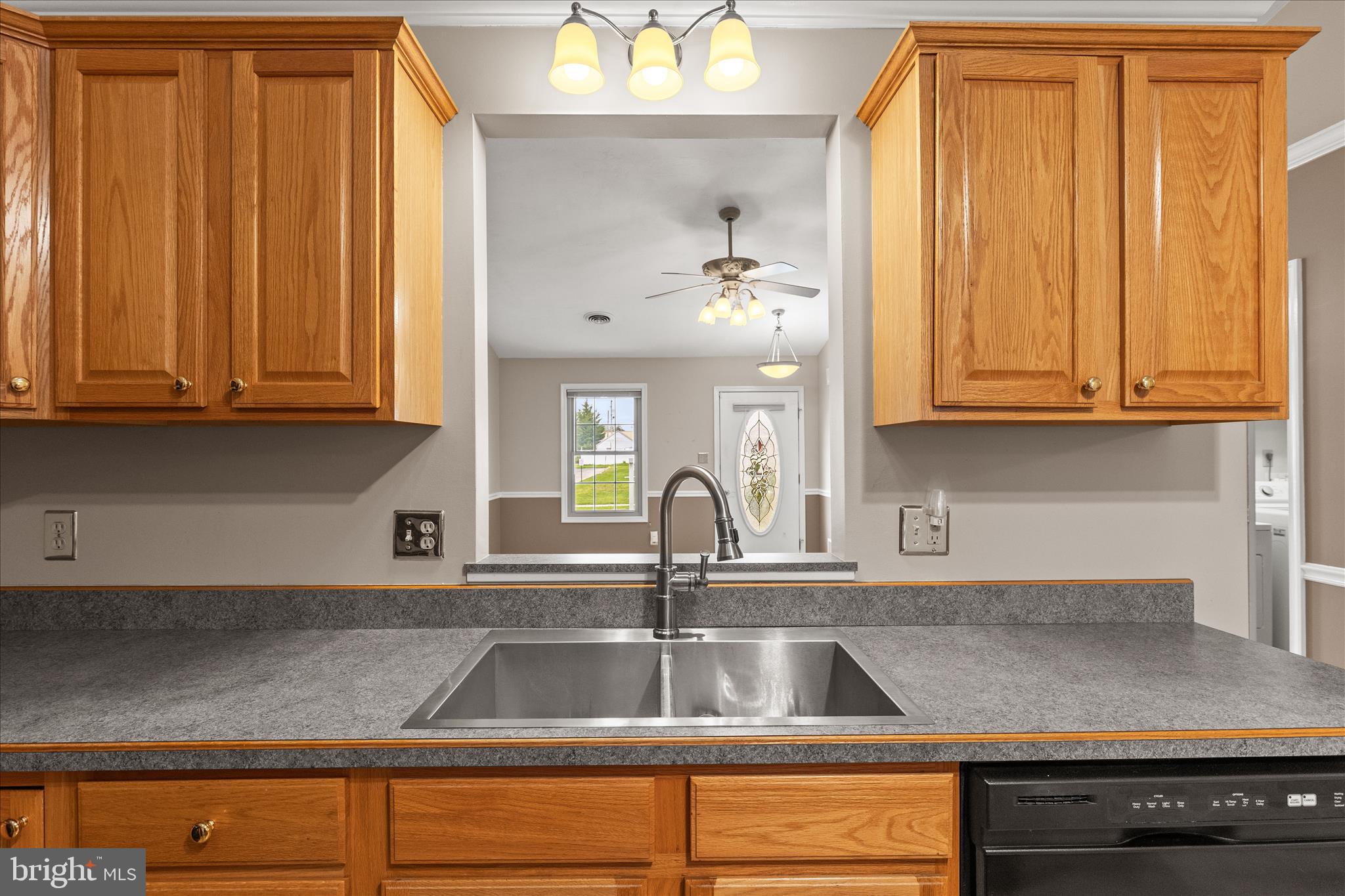 714 Randolph Street Hanover, PA 17331 - Photo 11 of 33 a kitchen with granite countertop a sink a window and cabinets