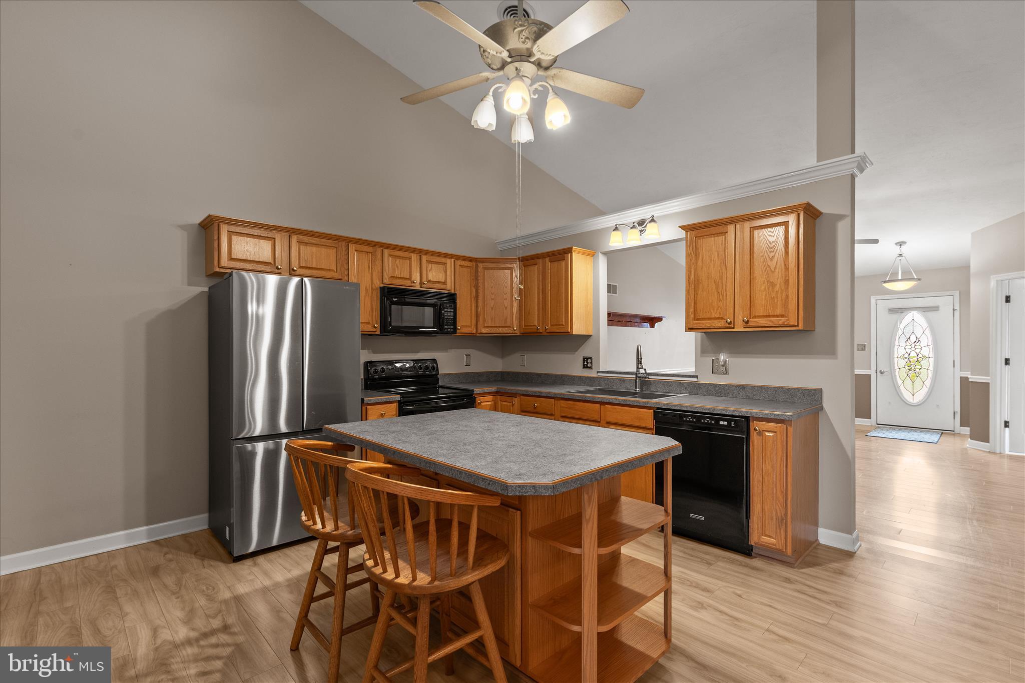714 Randolph Street Hanover, PA 17331 - Photo 9 of 33 a kitchen with stainless steel appliances granite countertop a refrigerator and a stove top oven
