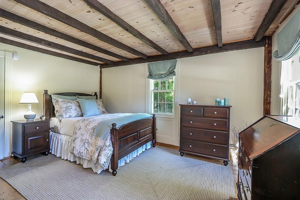 1401 Bay Road Sharon, MA 02067 - Photo 23 of 37 a bedroom with a bed and a window
