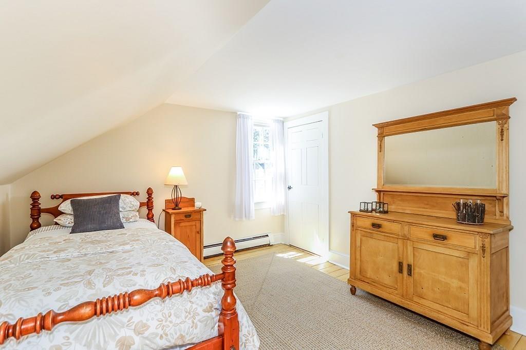 1401 Bay Road Sharon, MA 02067 - Photo 27 of 37 a bed room with a bed and dresser
