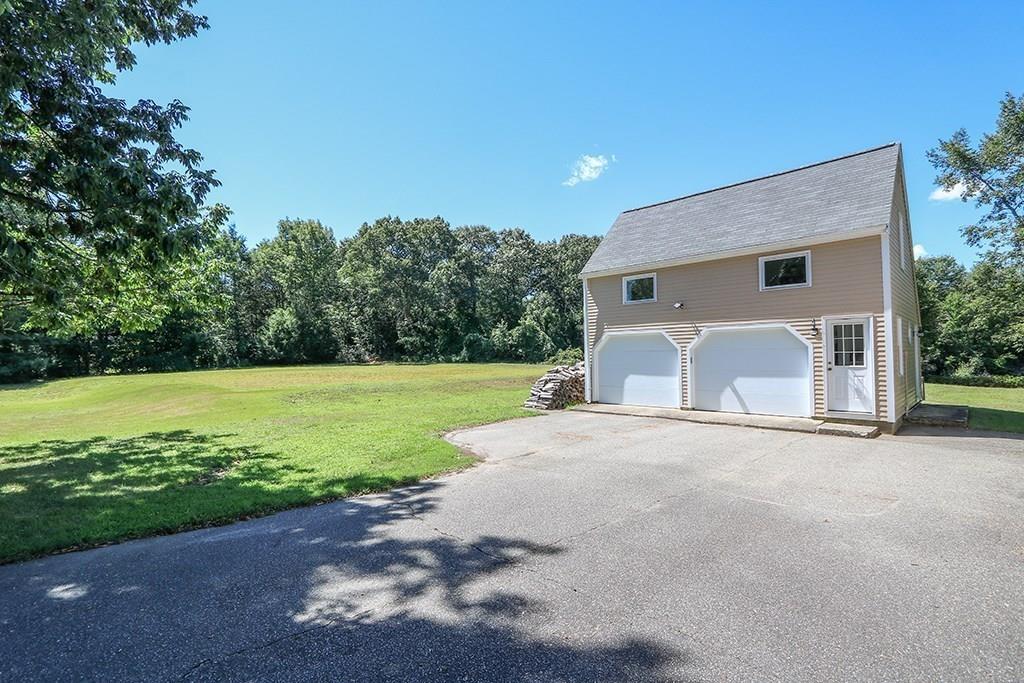 1401 Bay Road Sharon, MA 02067 - Photo 30 of 37 a view of a house with backyard and a garden