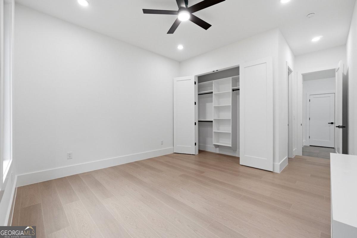 1563 Whitley Road Bethlehem, GA 30620 - Photo 23 of 44 an empty room with closet and a ceiling fan