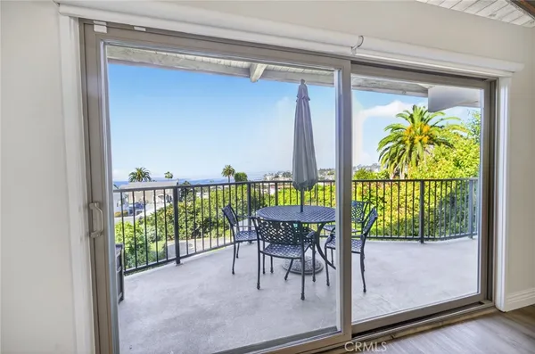 a view of a balcony with chairs