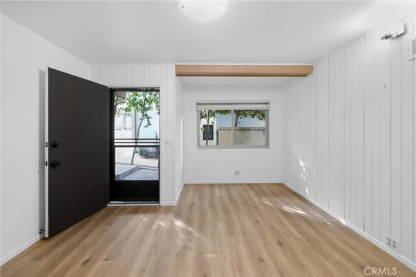 a view of a bench with potted plants