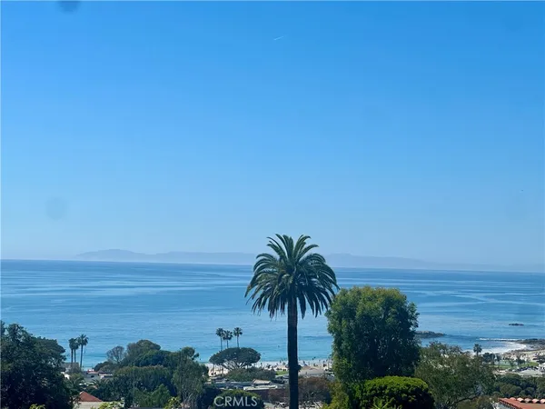 a kitchen with stainless steel appliances a refrigerator sink and cabinets