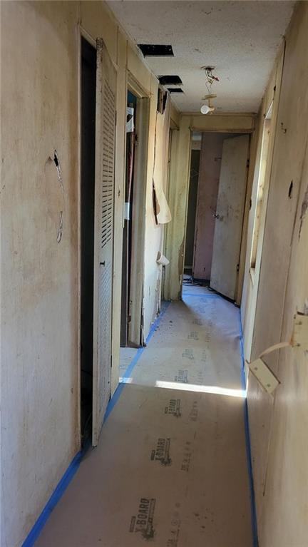 4683 Giddon Martin Road Gainesville, GA 30506 - Photo 6 of 7 a view of a hallway with wooden shelves