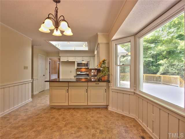 2701 Smokey Ridge Road Raleigh, NC 27613 - Photo 8 of 25 View of the breakfast nook looking into the kitchen. Large bay window accents the nook Breakfast Area