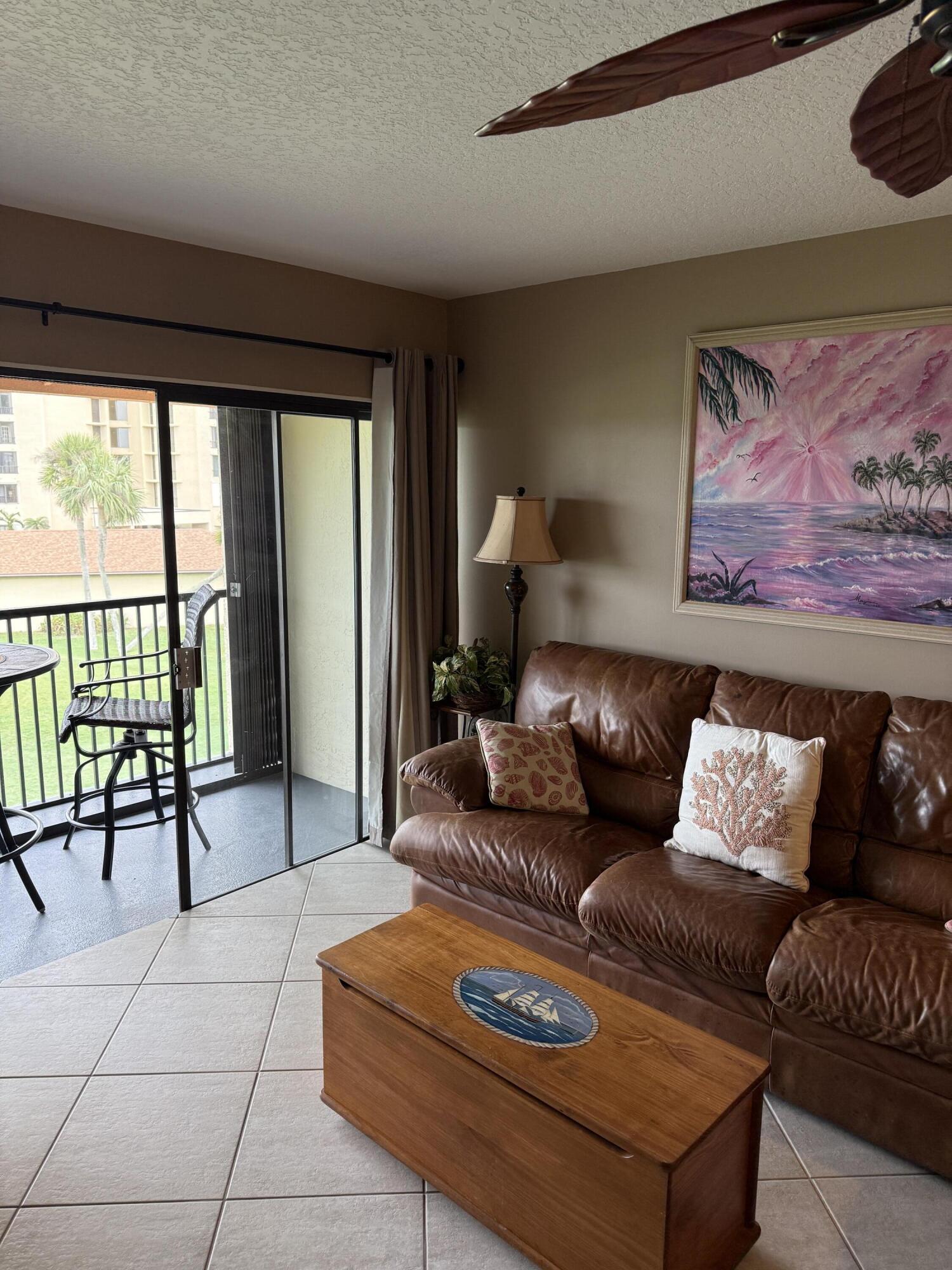 2400 South Ocean Drive, Unit 1034 Fort Pierce, FL 34949 - Photo 11 of 51 a living room with furniture and a large window
