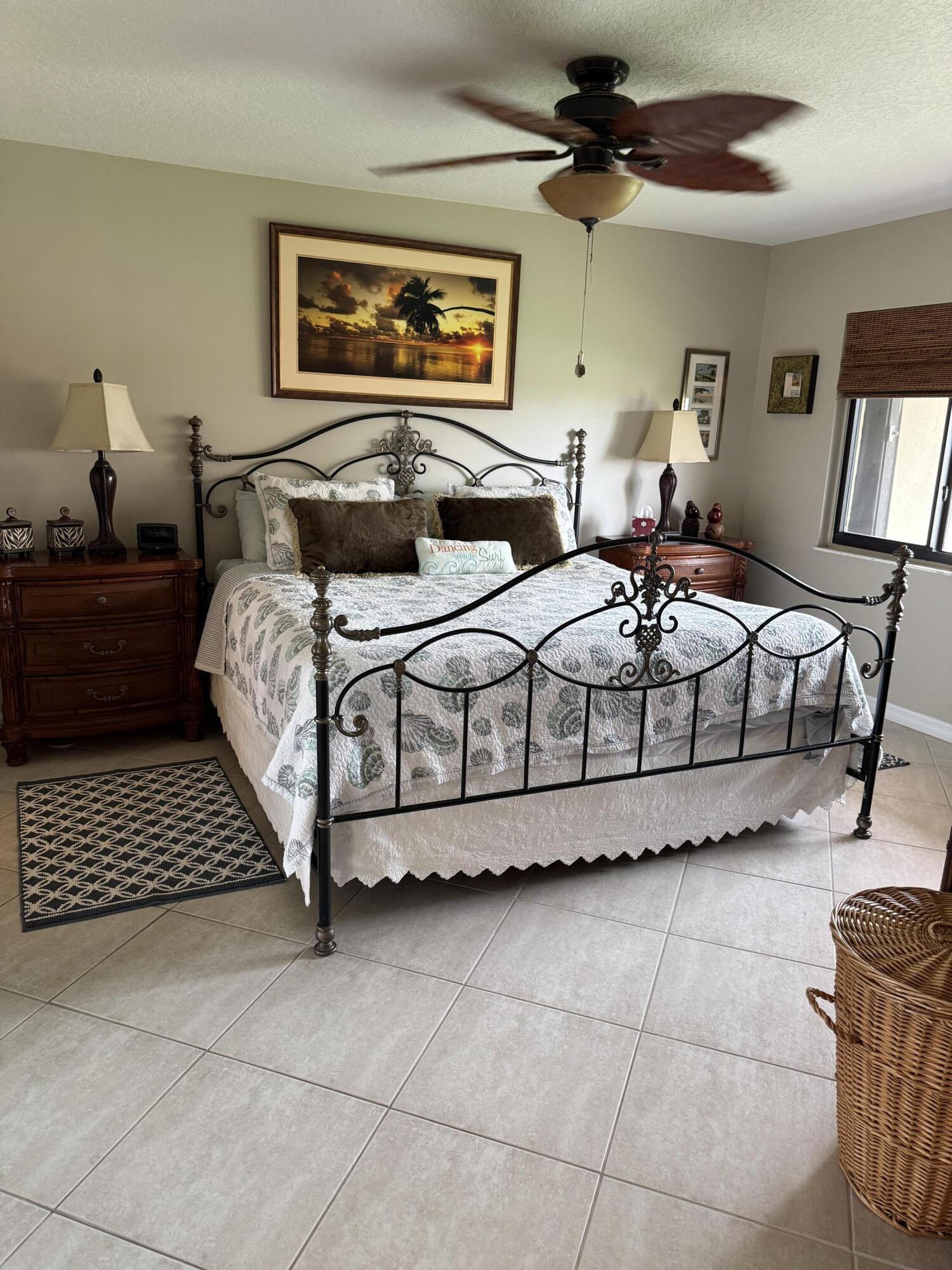 2400 South Ocean Drive, Unit 1034 Fort Pierce, FL 34949 - Photo 16 of 51 a bedroom with a bed and a painting on the wall