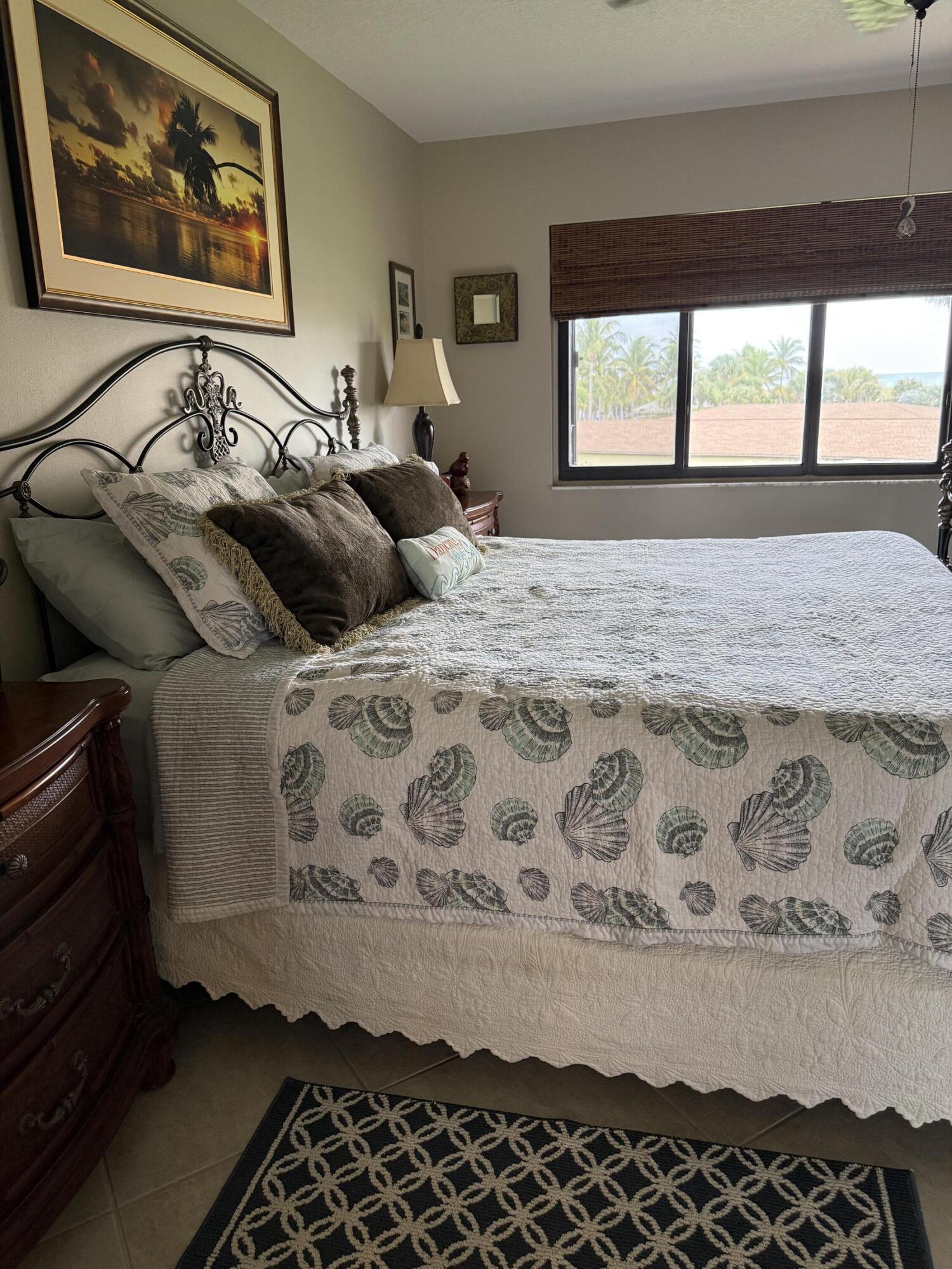 2400 South Ocean Drive, Unit 1034 Fort Pierce, FL 34949 - Photo 19 of 51 a bedroom with a bed and a painting on the wall