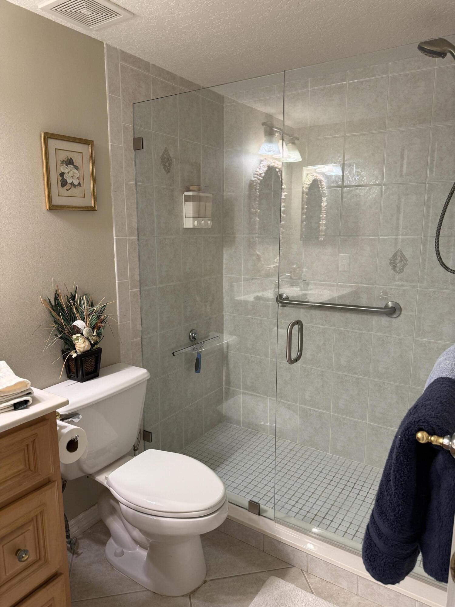 2400 South Ocean Drive, Unit 1034 Fort Pierce, FL 34949 - Photo 24 of 51 a bathroom with a toilet and a shower