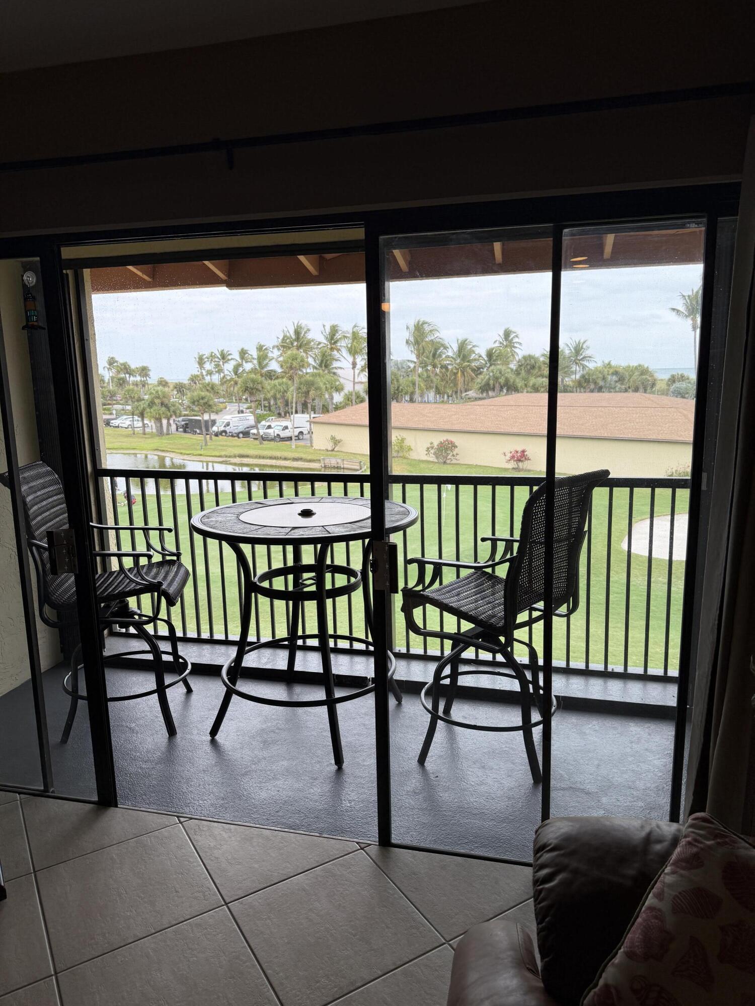 2400 South Ocean Drive, Unit 1034 Fort Pierce, FL 34949 - Photo 29 of 51 a view of a chairs and table in the balcony