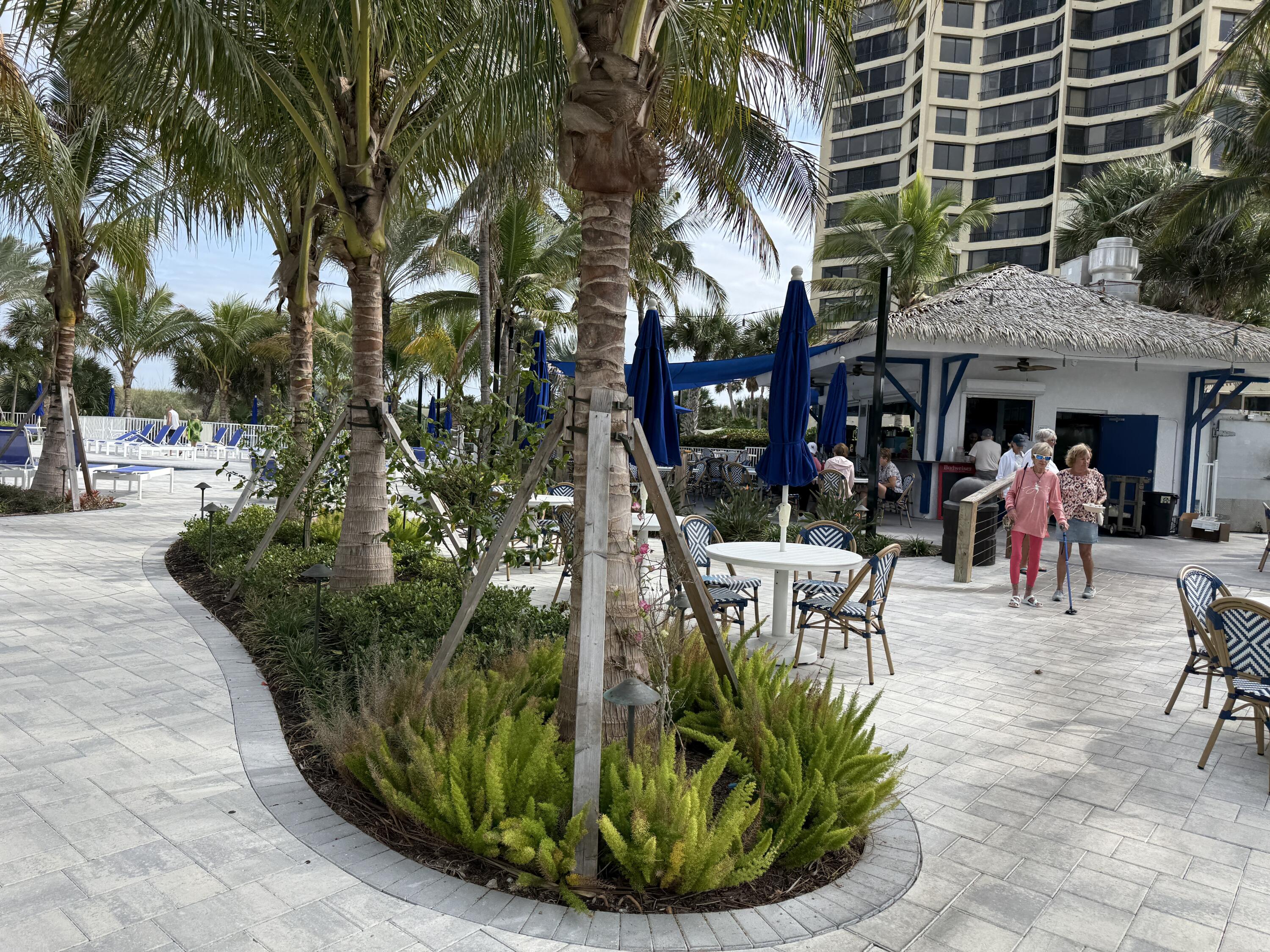 2400 South Ocean Drive, Unit 1034 Fort Pierce, FL 34949 - Photo 34 of 51 a view of a chairs and table in a backyard