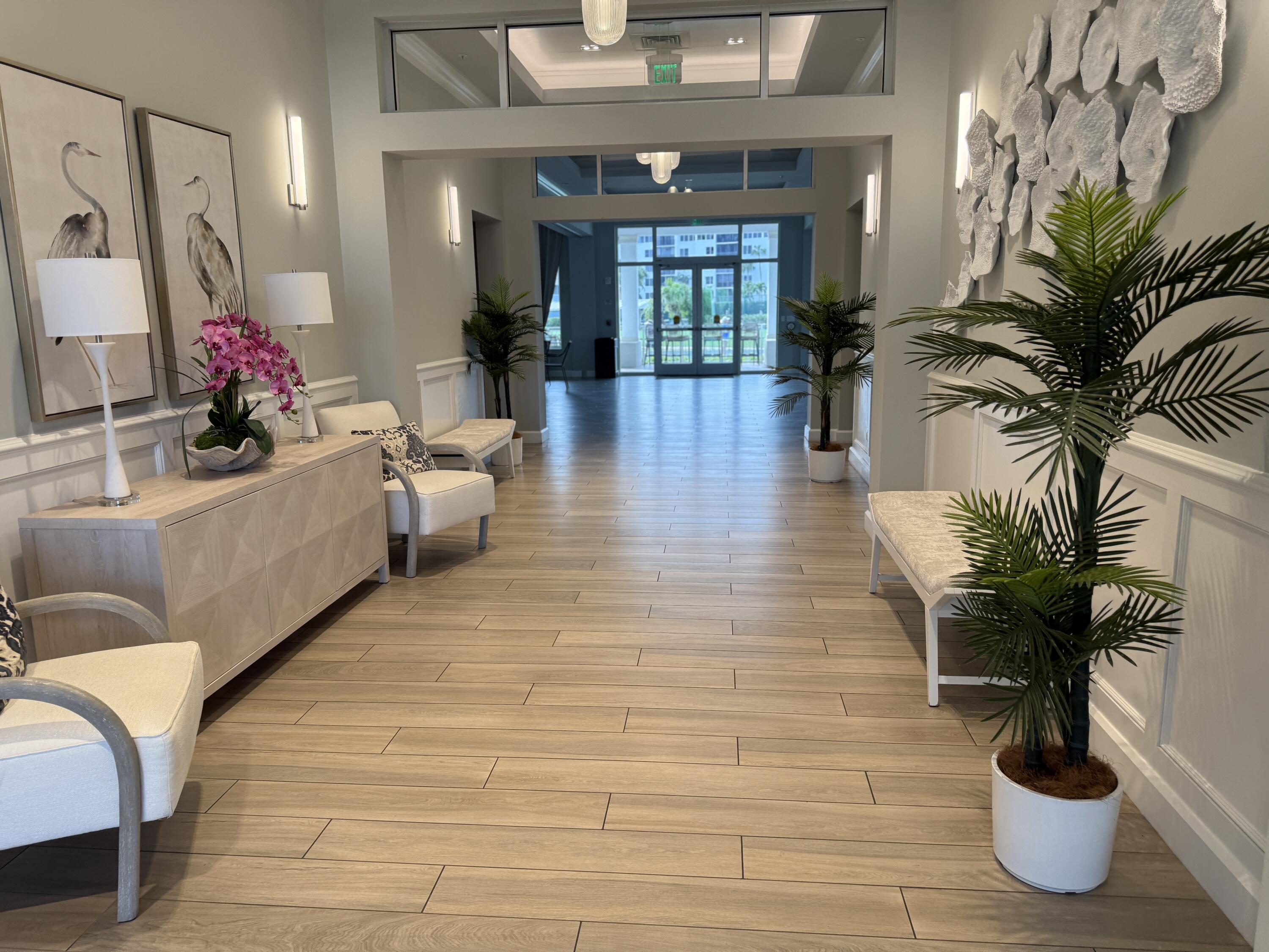 2400 South Ocean Drive, Unit 1034 Fort Pierce, FL 34949 - Photo 45 of 51 a lobby with furniture and flowers