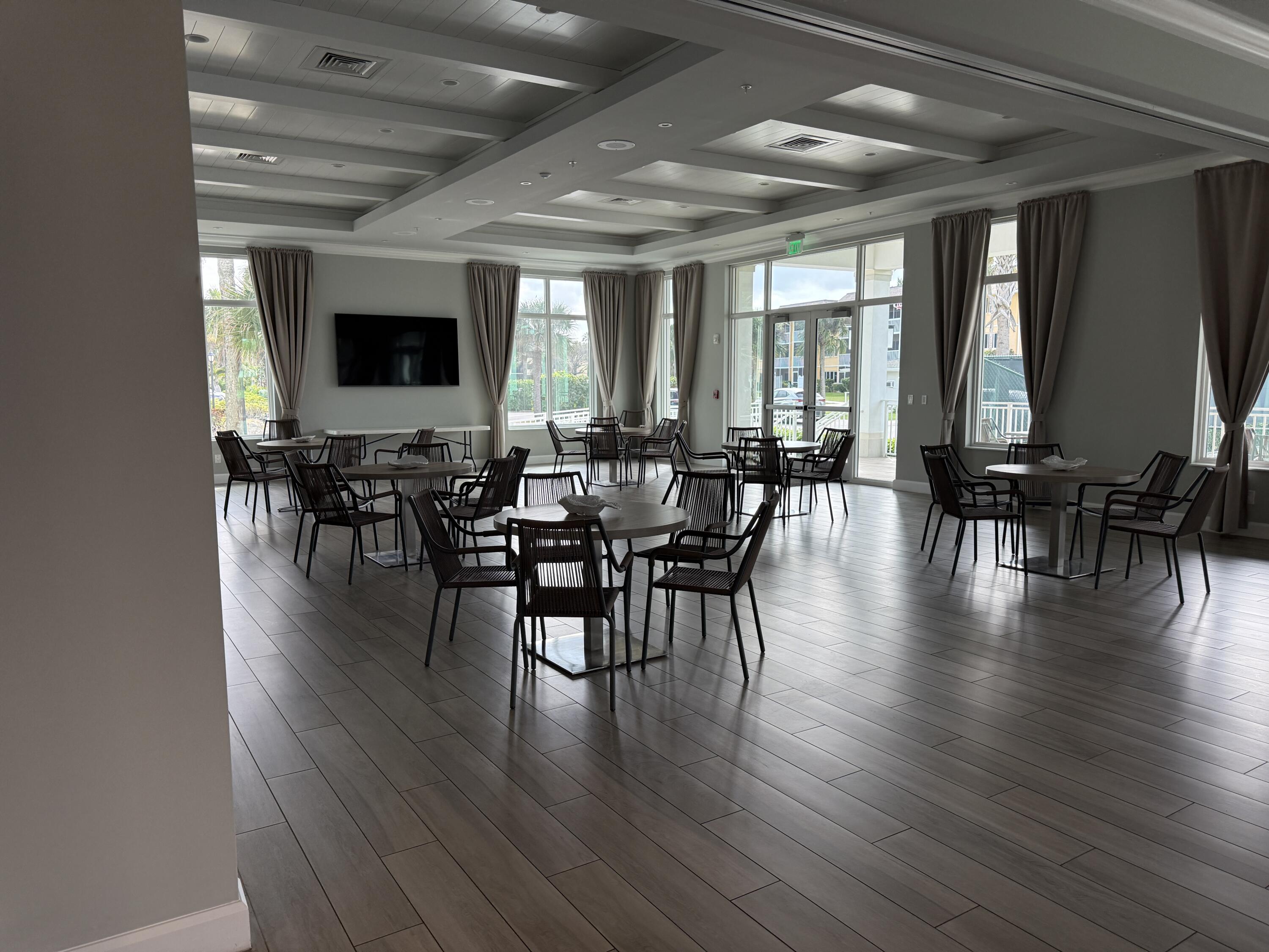 2400 South Ocean Drive, Unit 1034 Fort Pierce, FL 34949 - Photo 46 of 51 a view of a dining room with furniture window and wooden floor