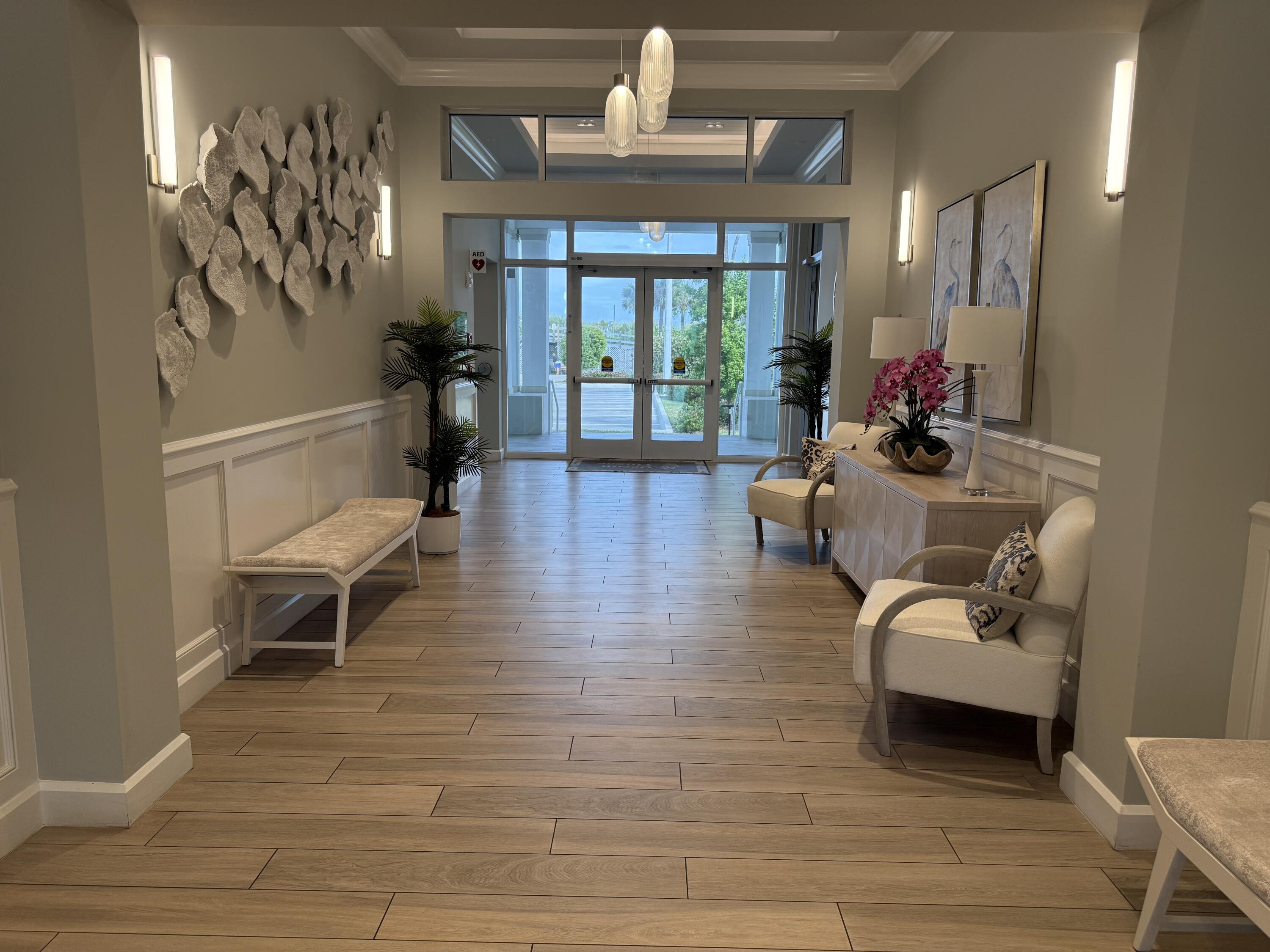 2400 South Ocean Drive, Unit 1034 Fort Pierce, FL 34949 - Photo 48 of 51 a living room with furniture and a fireplace