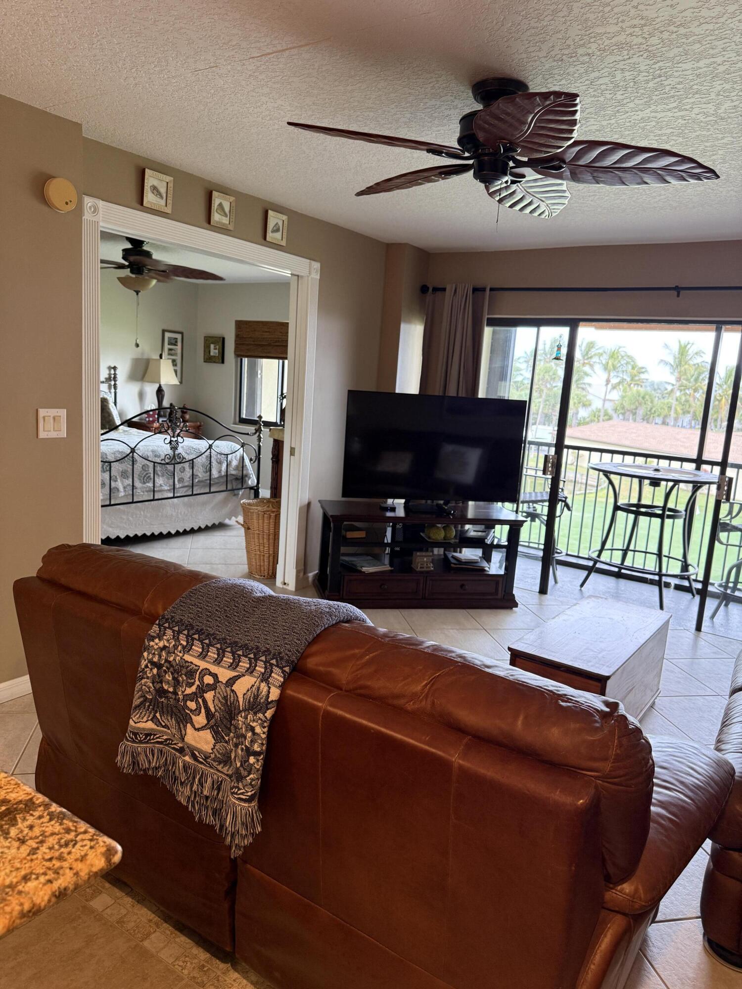 2400 South Ocean Drive, Unit 1034 Fort Pierce, FL 34949 - Photo 10 of 51 a living room with furniture and a flat screen tv