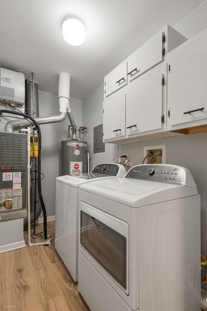 -n120 Windermere Road, Unit 2008 Winfield, IL 60190 - Photo 11 of 23 a utility room with cabinets washer and dryer