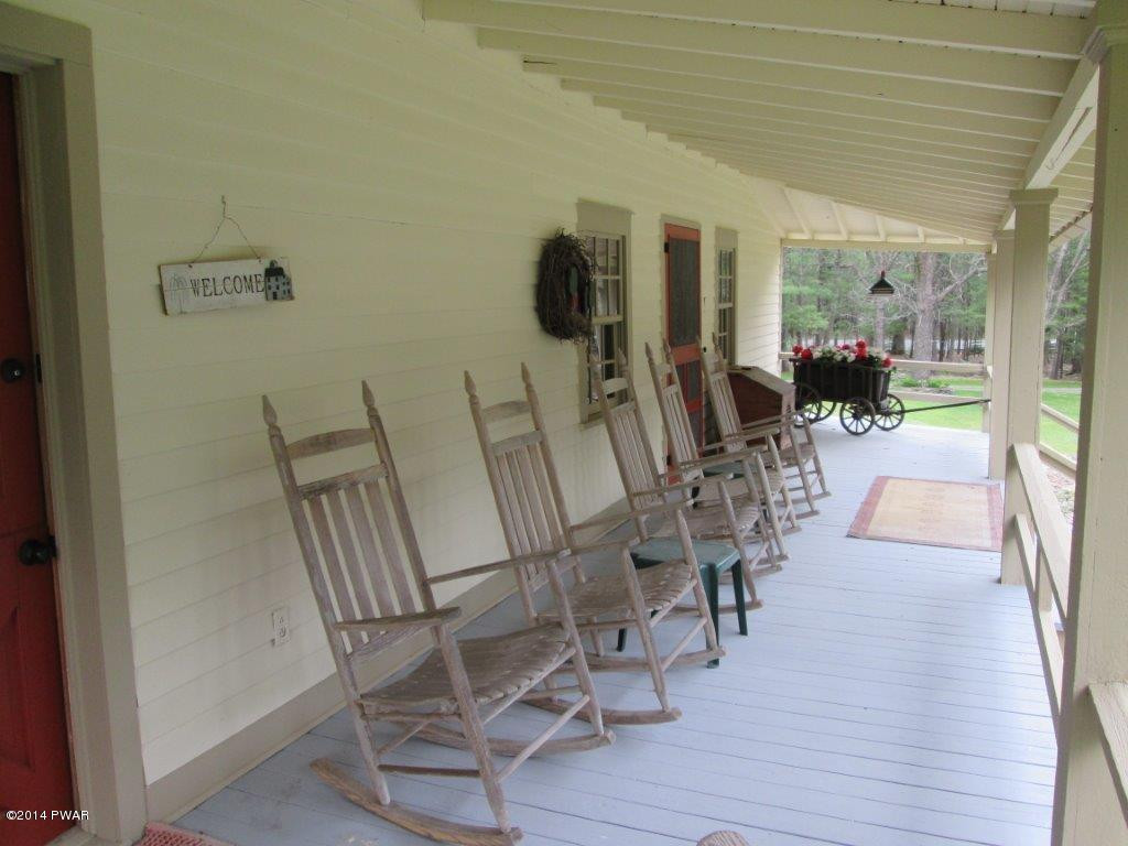 877 Welcome Lake Road Hawley, PA 18428 - Photo 50 of 78 ROCKING CHAIR PORCH
