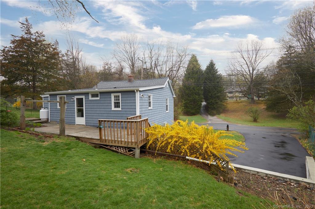 163 Huntingtown Road Newtown, CT 06470 - Photo 1 of 1 a view of a house with a yard