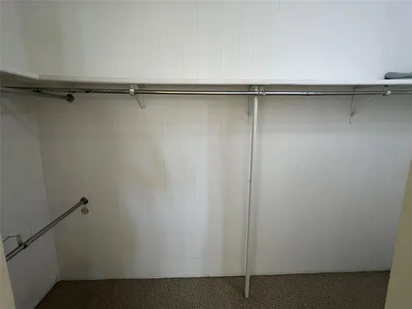 a bedroom with a bed and a table in it