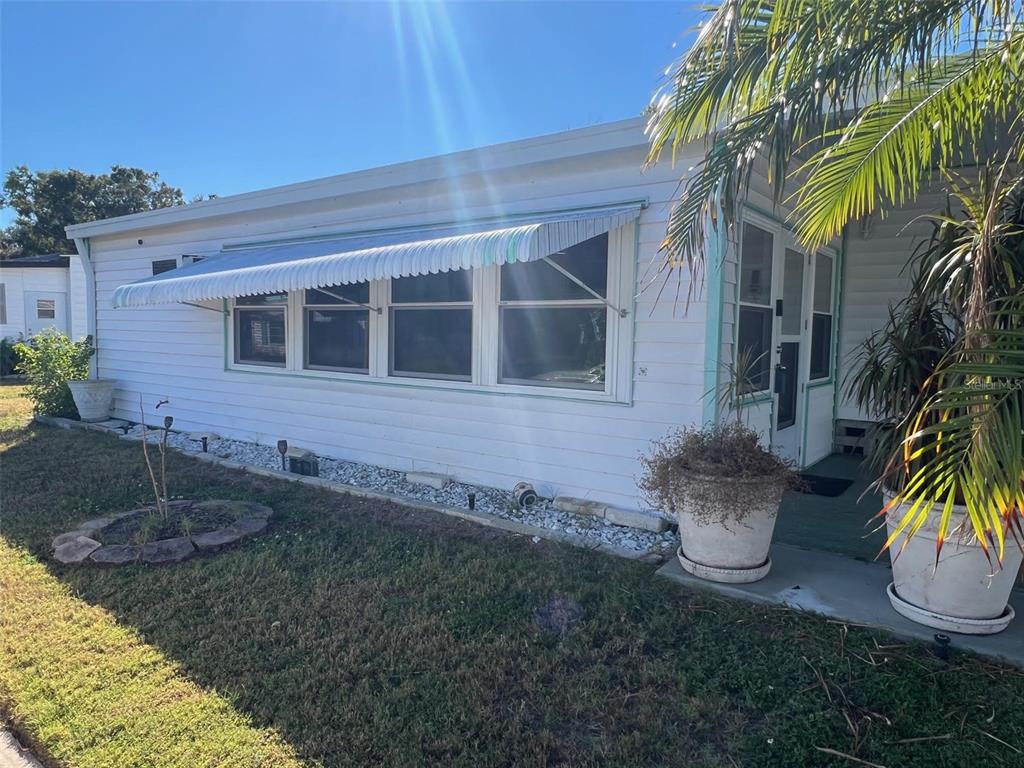 701 Sugar Palm Street Largo, FL 33770 - Photo 4 of 30 a front view of a house with a yard