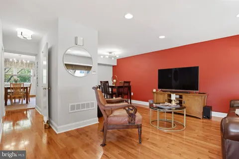 a view of a livingroom with furniture and a flat screen tv