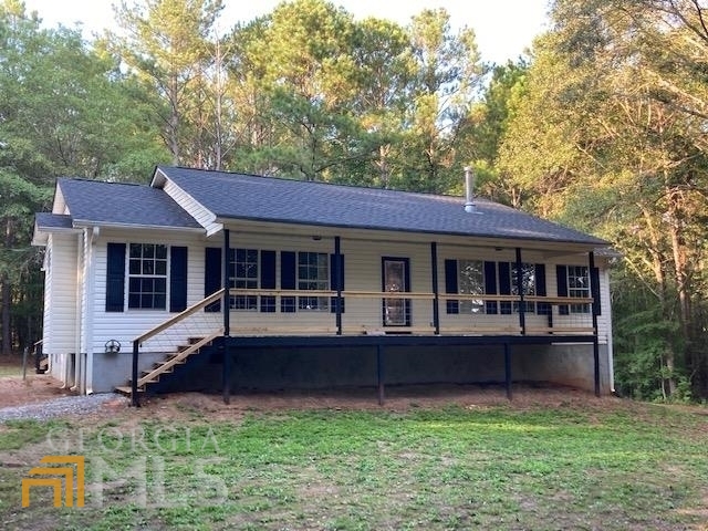 1017 Glover Road Zebulon, GA 30295 - Photo 1 of 1 a front view of a house with a yard
