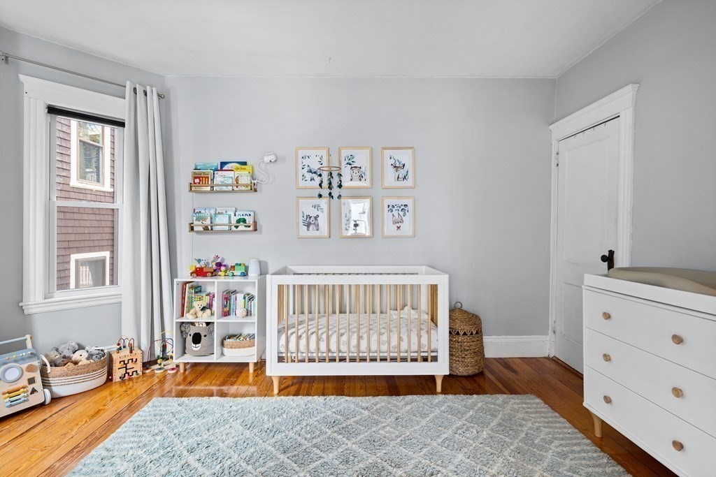 32 Parkton Road, Unit 2 Boston, MA 02130 - Photo 14 of 23 a bedroom with furniture and a window