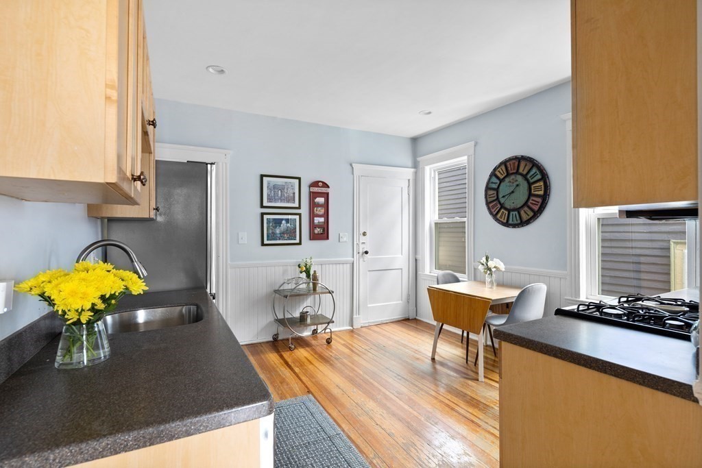 32 Parkton Road, Unit 2 Boston, MA 02130 - Photo 5 of 23 a living room with dining room and wooden floor