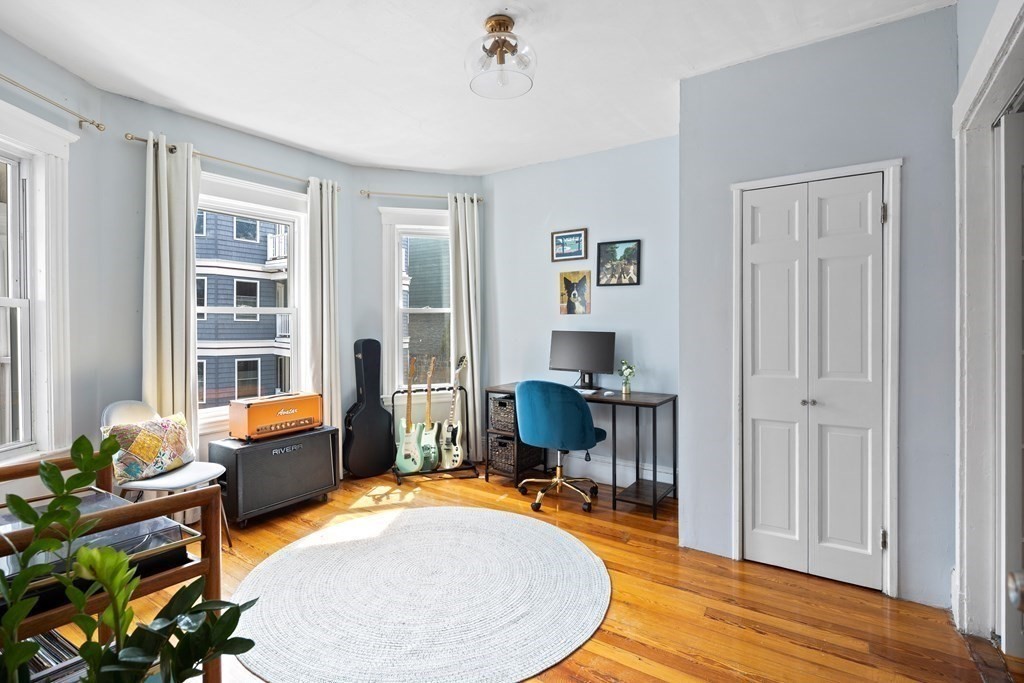32 Parkton Road, Unit 2 Boston, MA 02130 - Photo 10 of 23 a room with furniture and a wooden floor