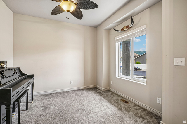 203 North 1900th Street West Mapleton, UT 84664 - Photo 23 of 48 Room featuring a double-pane window with white trim, neutral wall paint, and gray carpet