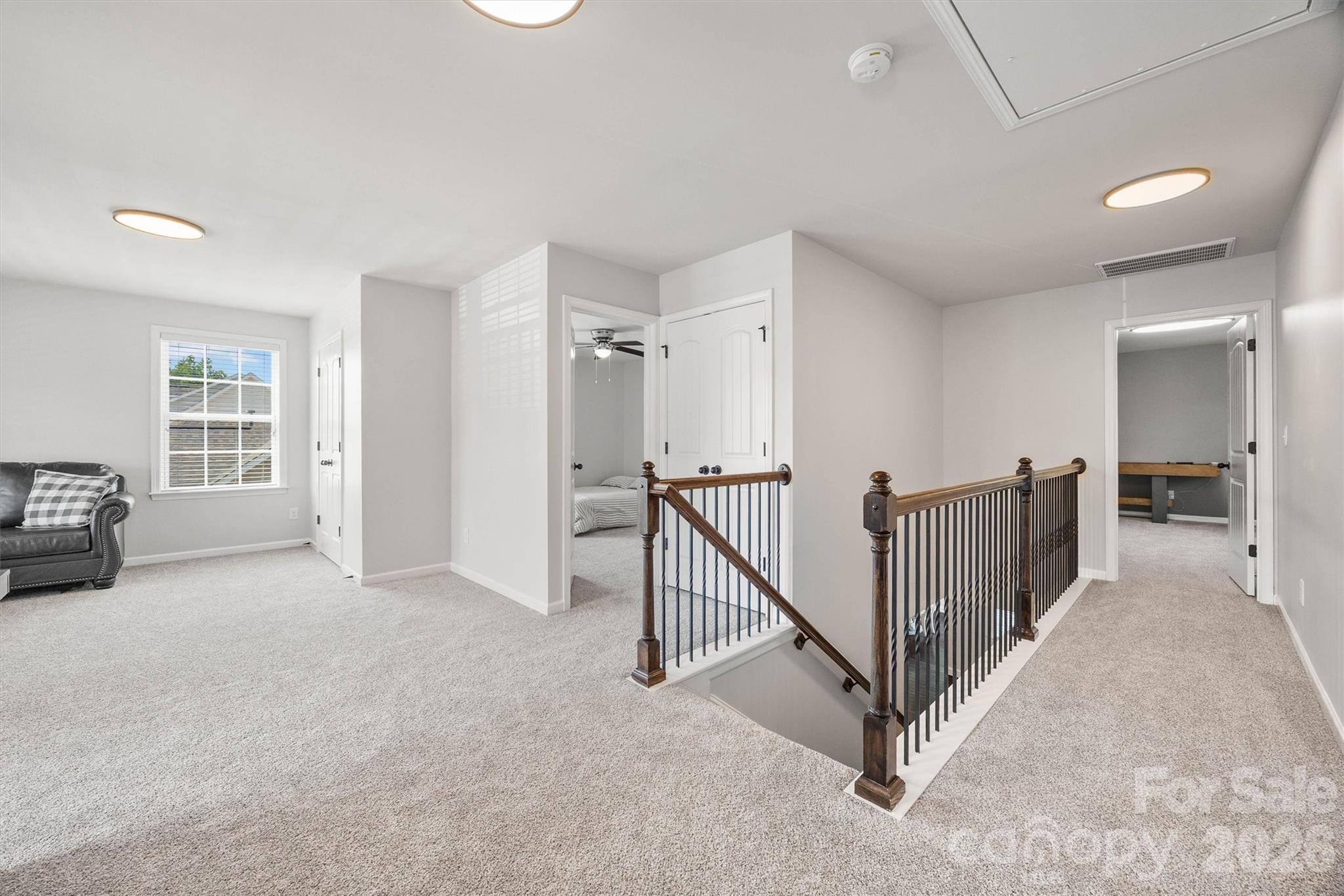 299 Annatto Way Tega Cay, SC 29708 - Photo 30 of 46 a view of a livingroom with stairs and a furniture