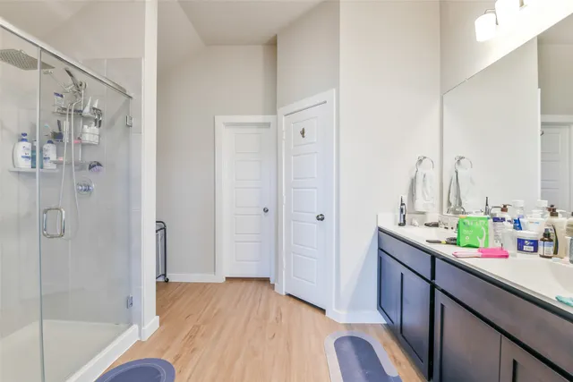 a kitchen with a sink and a mirror