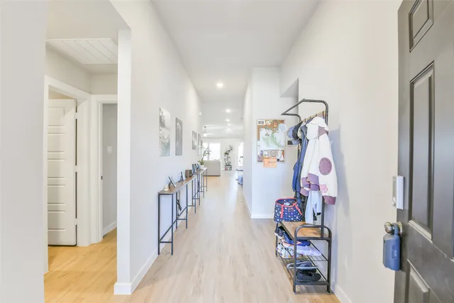 a view of an entryway with wooden floor