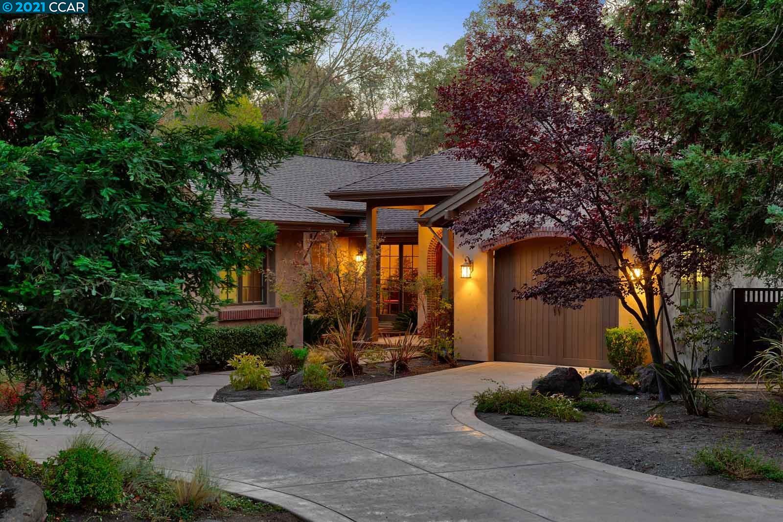 Undisclosed Address Diablo, CA 94526 - Photo 2 of 40 a front view of a house with a yard