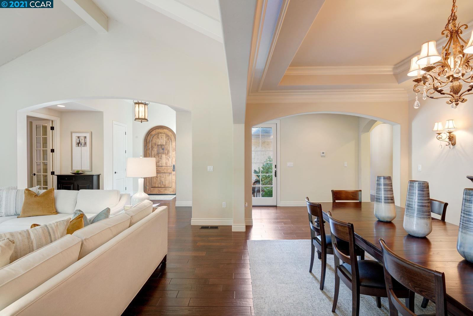 Undisclosed Address Diablo, CA 94526 - Photo 13 of 40 a living room with furniture and a chandelier