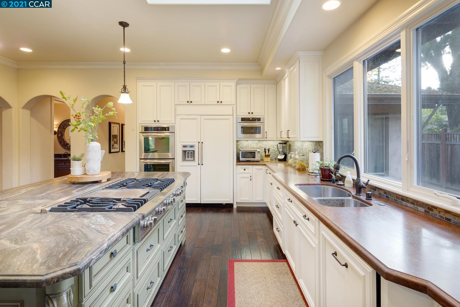 Undisclosed Address Diablo, CA 94526 - Photo 20 of 40 a kitchen with stainless steel appliances granite countertop a sink a stove and a refrigerator