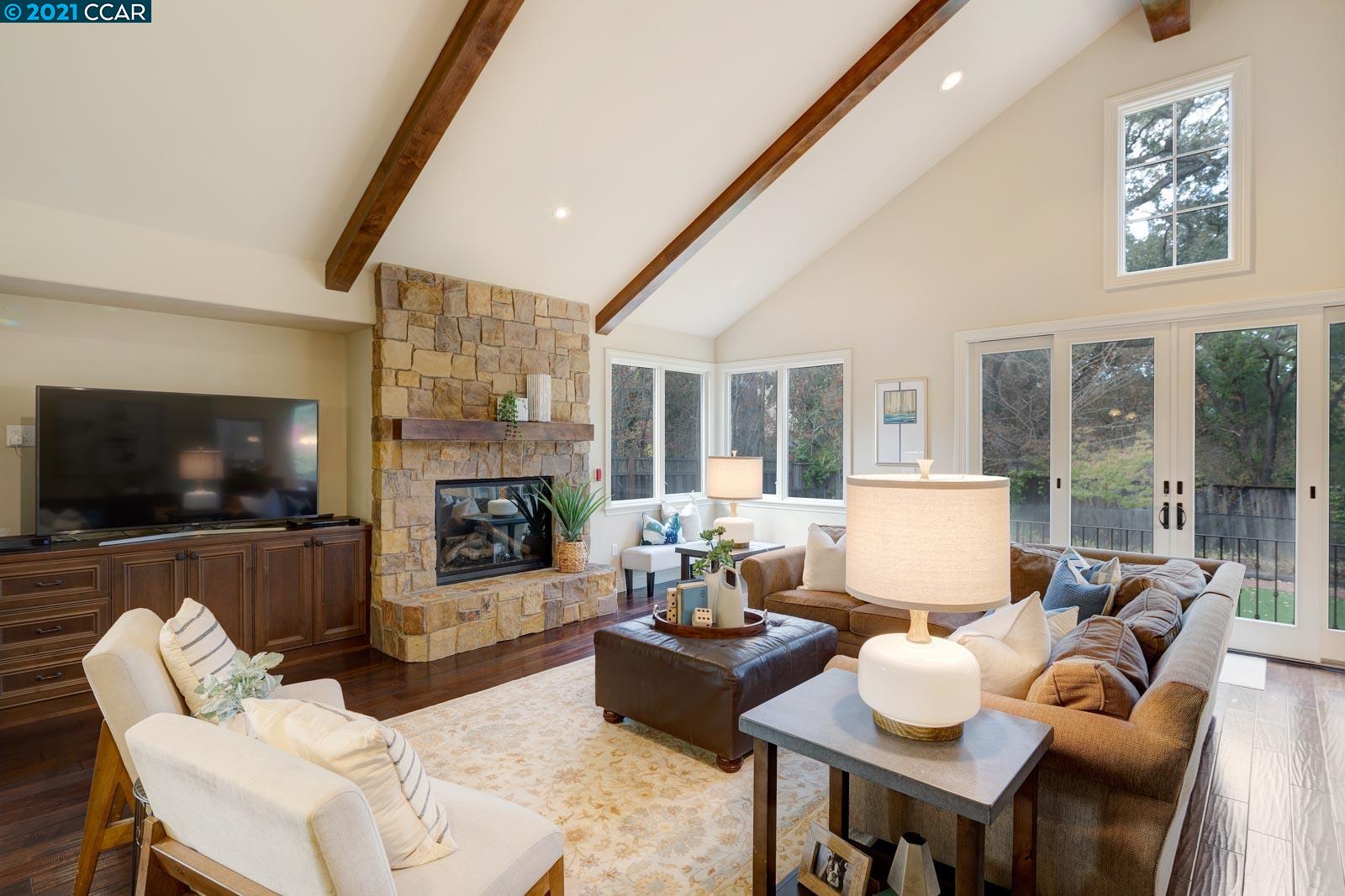 Undisclosed Address Diablo, CA 94526 - Photo 22 of 40 a living room with furniture a flat screen tv and a fireplace