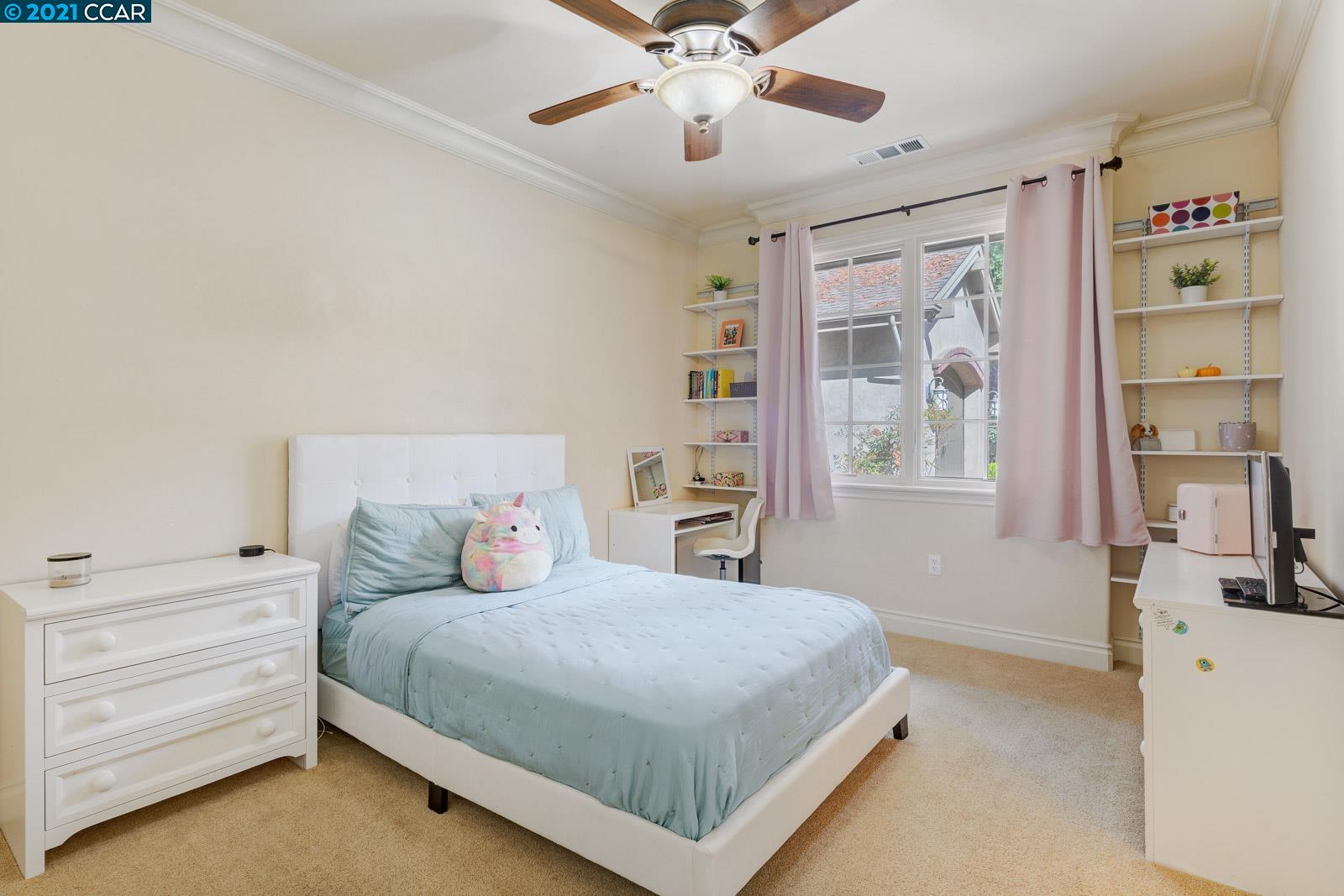 Undisclosed Address Diablo, CA 94526 - Photo 33 of 40 a bedroom with a large bed and a chandelier