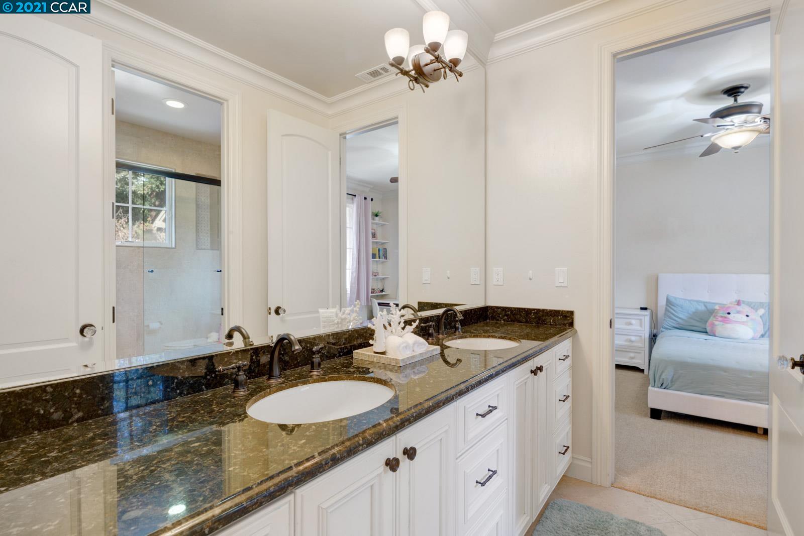 Undisclosed Address Diablo, CA 94526 - Photo 34 of 40 a bathroom with a granite countertop double vanity sink and a mirror