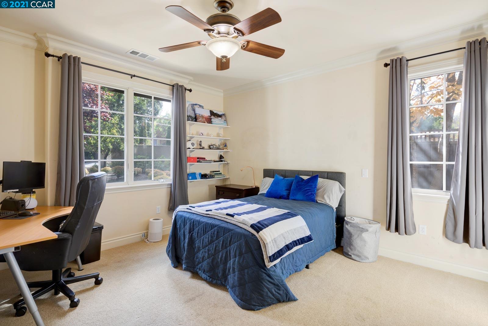 Undisclosed Address Diablo, CA 94526 - Photo 35 of 40 a bedroom with a large bed and a desk