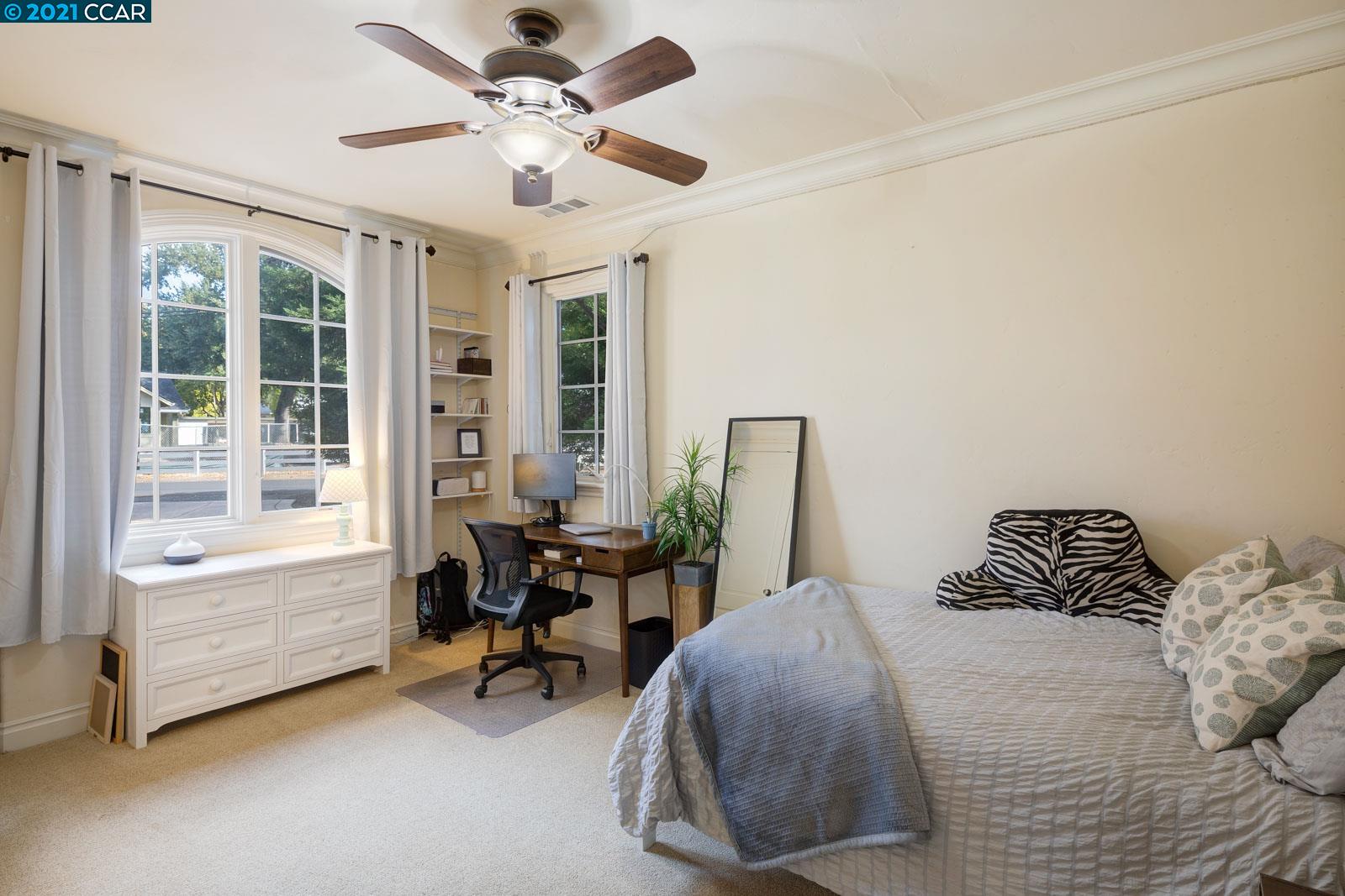 Undisclosed Address Diablo, CA 94526 - Photo 37 of 40 a bedroom with a bed and a table in it