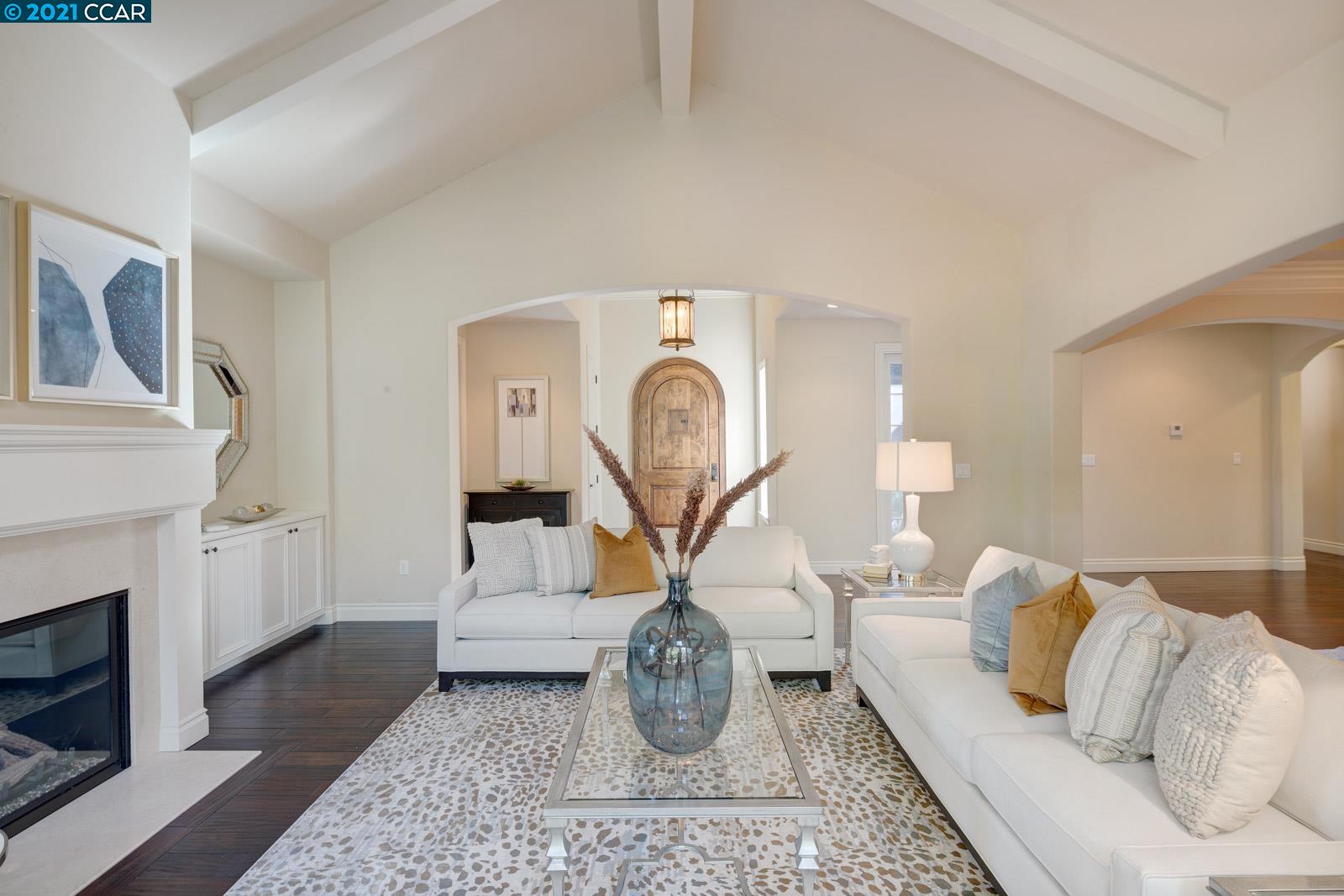 Undisclosed Address Diablo, CA 94526 - Photo 7 of 40 a living room with furniture a fireplace and rug