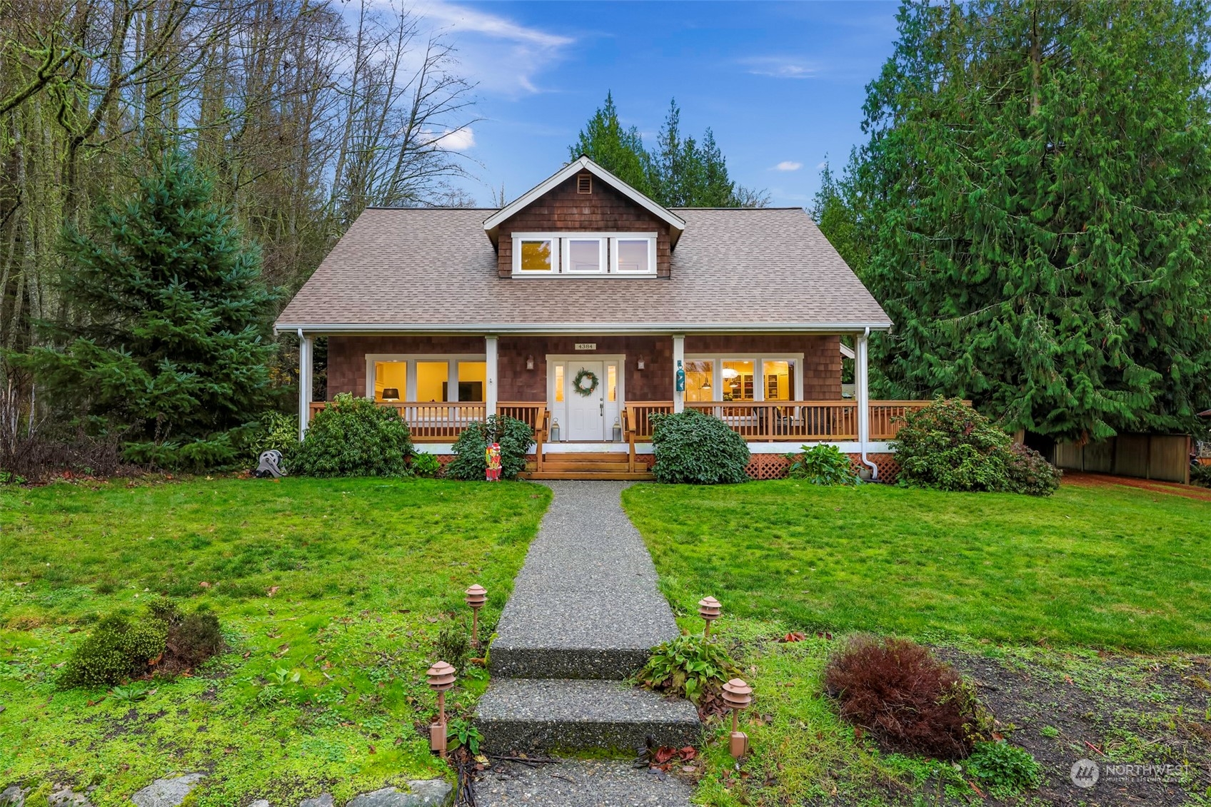 4384 Salmon Run Road Anacortes, WA 98221 - Photo 1 of 34 a front view of a house with yard and green space