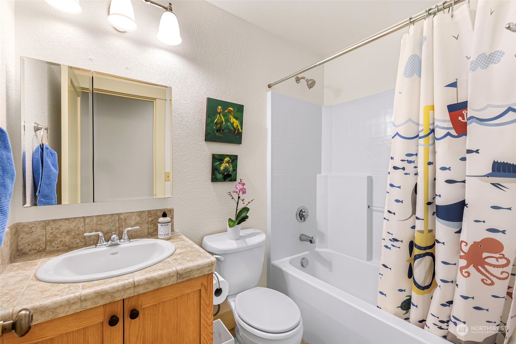 4384 Salmon Run Road Anacortes, WA 98221 - Photo 17 of 34 a bathroom with a sink toilet tub and shower