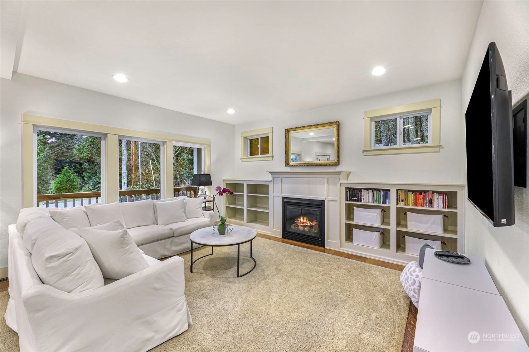 4384 Salmon Run Road Anacortes, WA 98221 - Photo 2 of 34 a living room with furniture and a fireplace