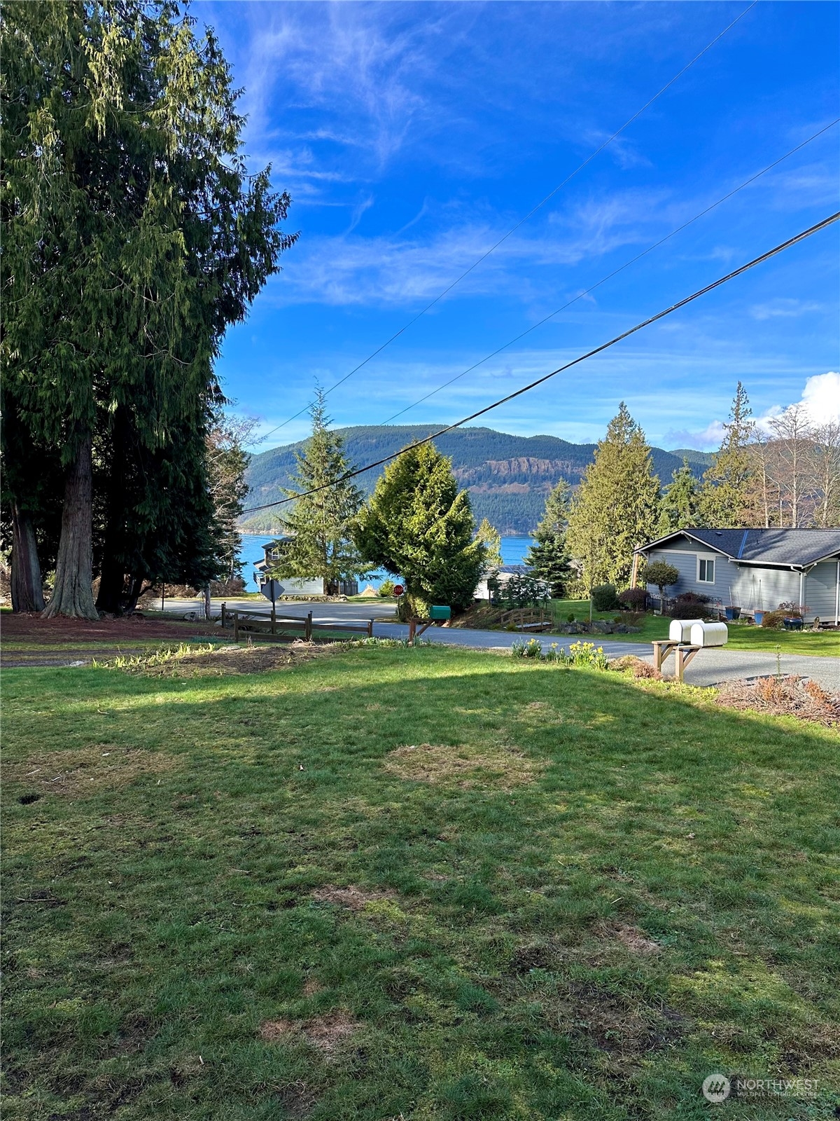 4384 Salmon Run Road Anacortes, WA 98221 - Photo 27 of 34 a view of yard with seating area and green space