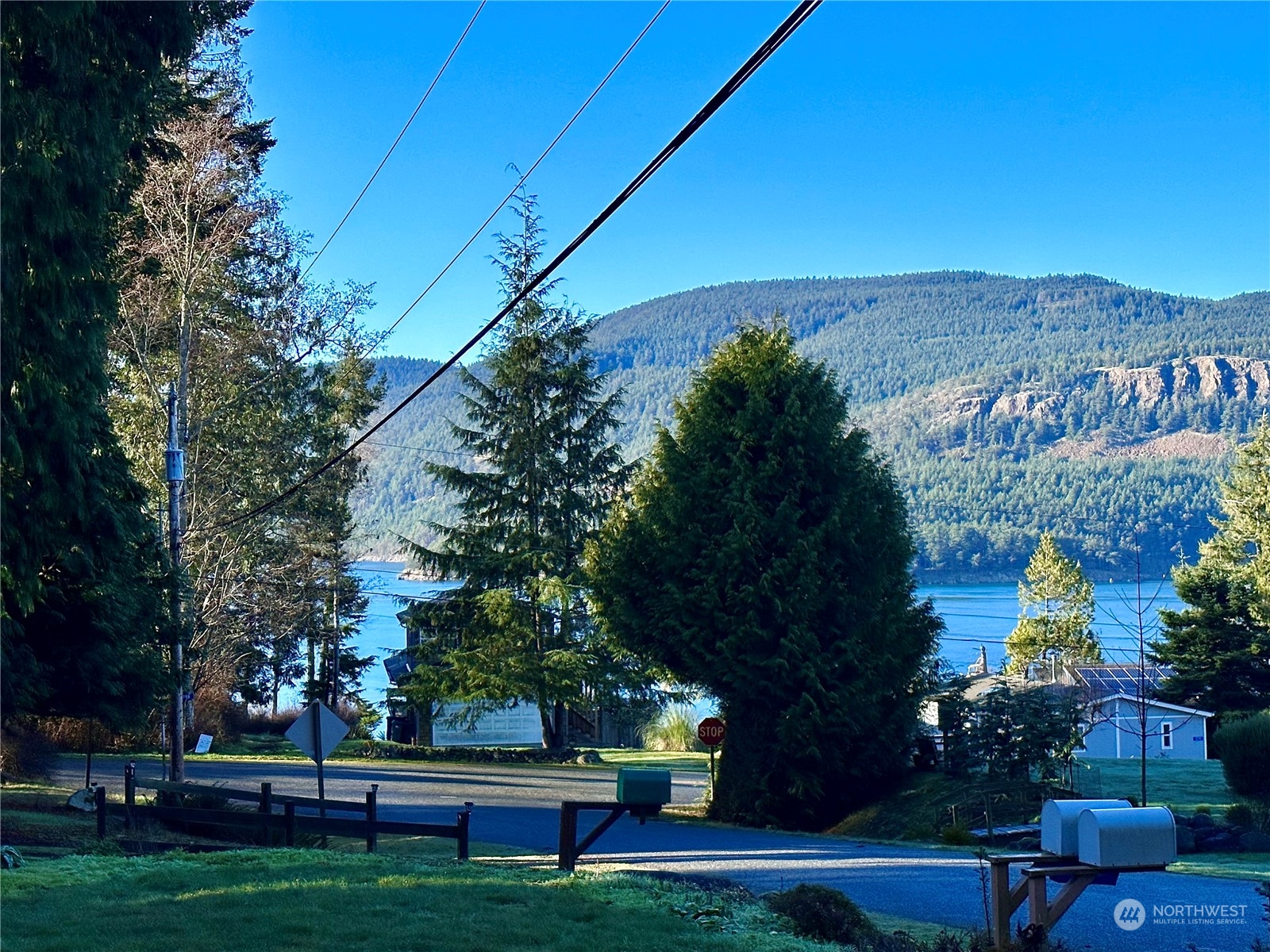 4384 Salmon Run Road Anacortes, WA 98221 - Photo 28 of 34 a view of yard with seating area and green space
