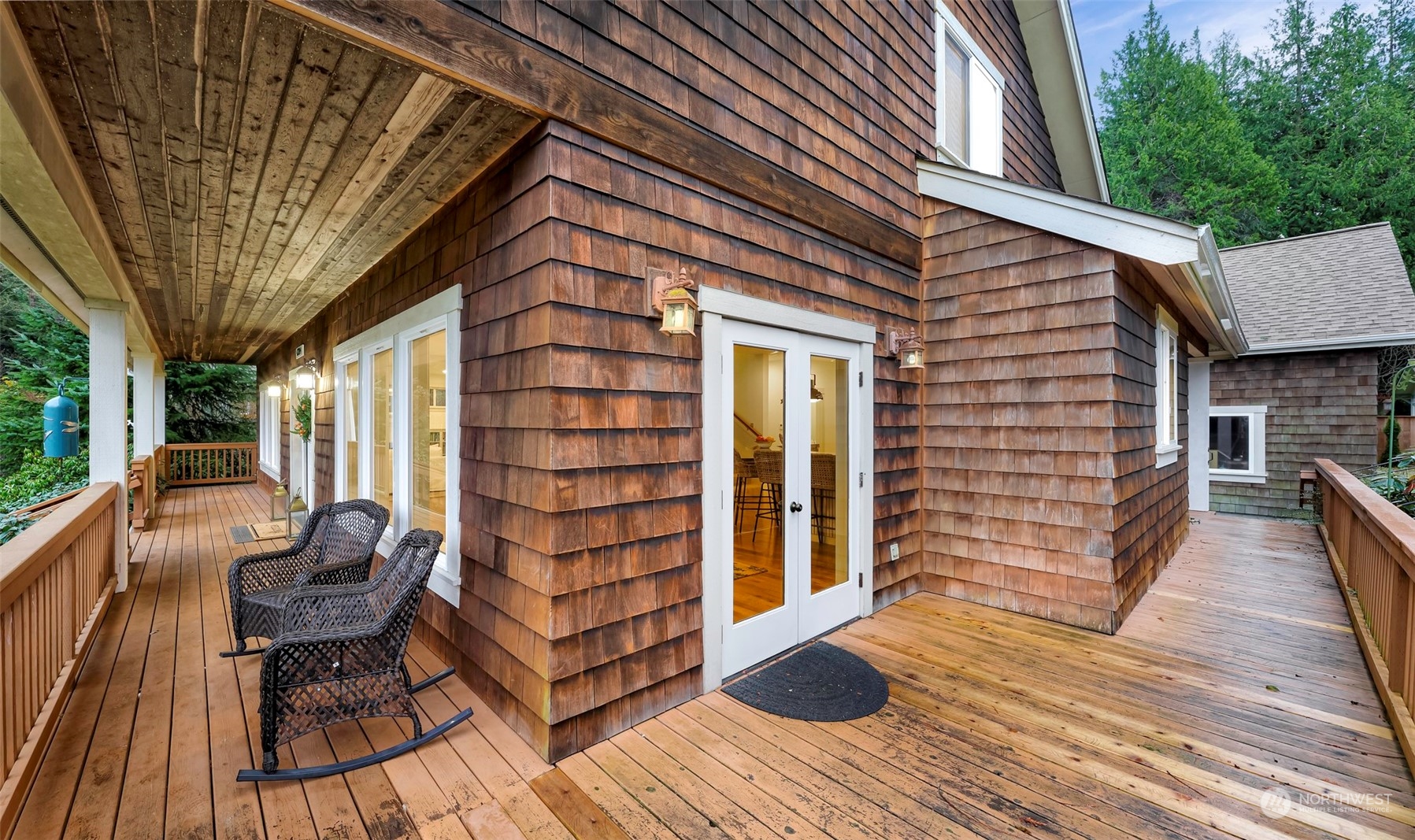 4384 Salmon Run Road Anacortes, WA 98221 - Photo 34 of 34 a porch with seating space and hardwood floor